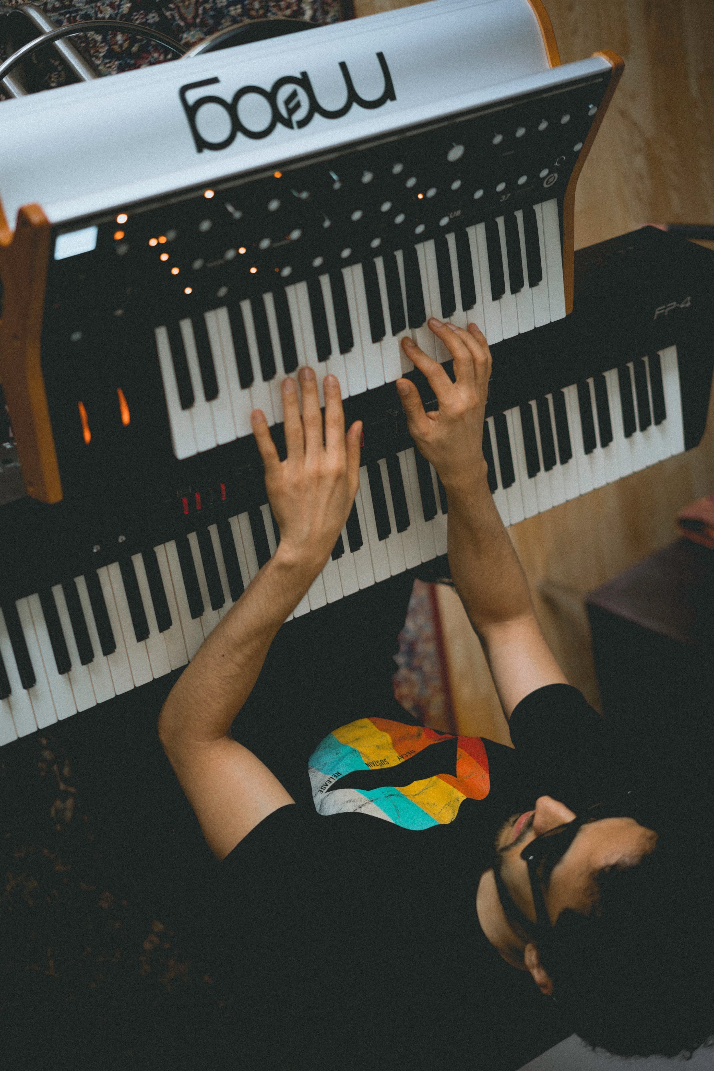 Stellar Dean playing a dual-manual keyboard from above